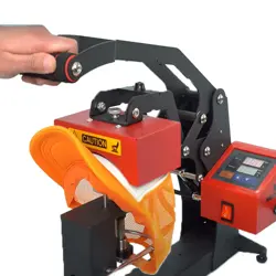 Heat press machine applying a patch to a hat